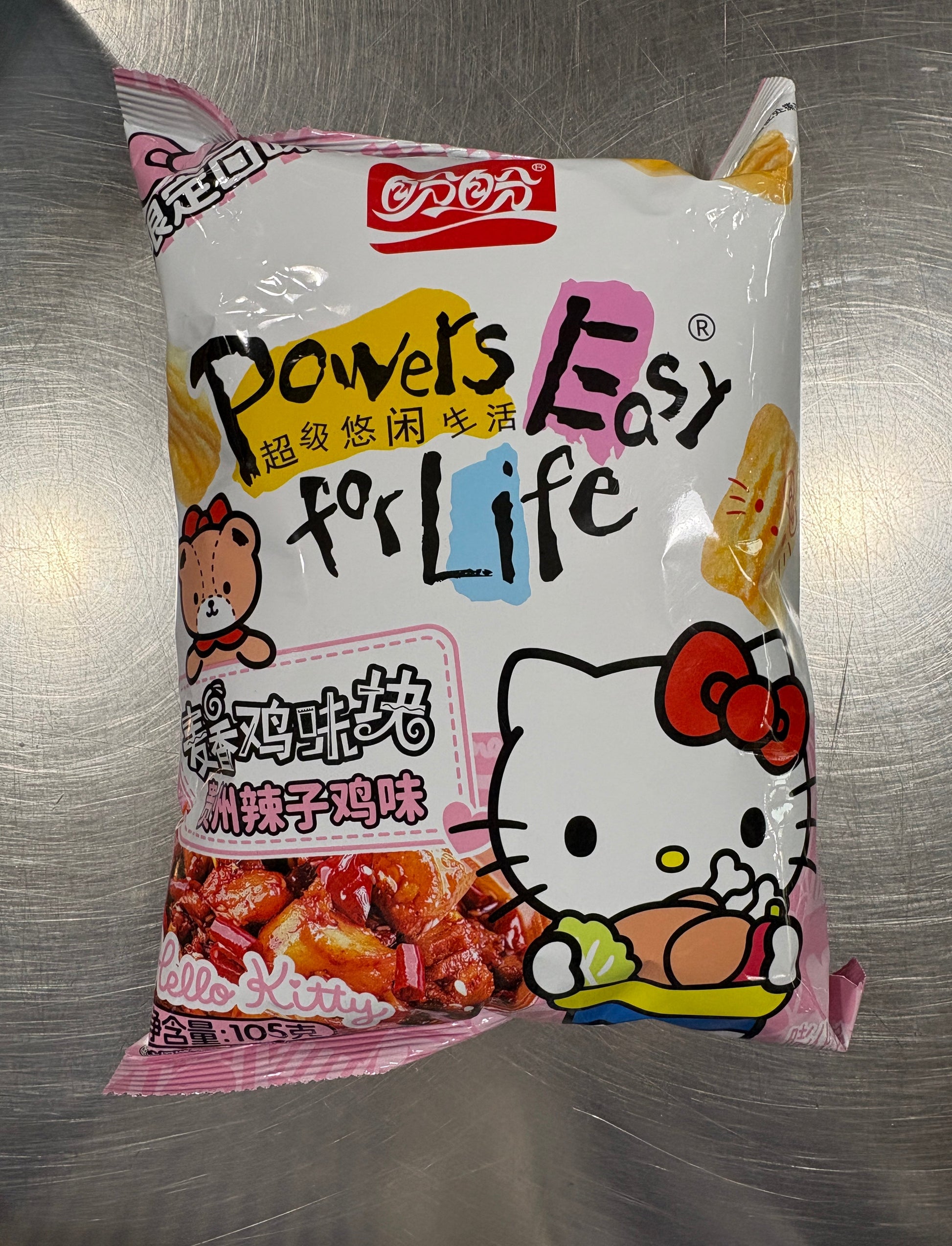 Hello Kitty spicy chicken rice cracker from Sweet Palace, showing crispy snack with Hello Kitty character design on packaging.