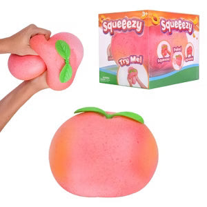 Sweet Palace Original Squeeezy Peach plush toy with soft peach-colored fabric and smiling face on a white background.