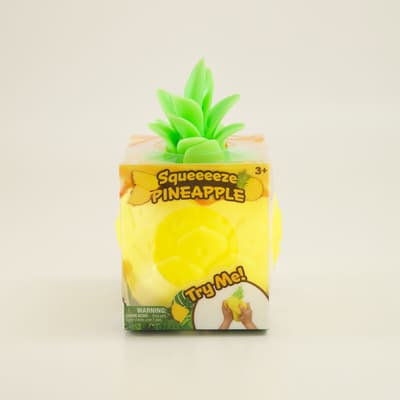 Original Squeeezy Pineapple from Sweet Palace, soft squeeze toy with a bright yellow pineapple design and textured surface.