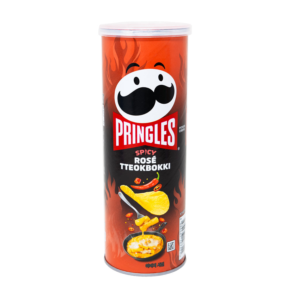 Pringles Spicy Rose Tteokbokki flavored potato chips in a bright, colorful package with bold red and pink design elements.