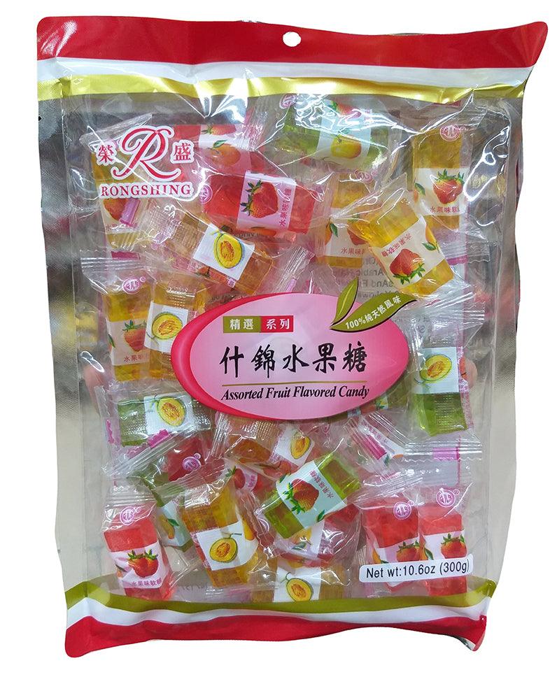 Assorted Rongshing fruit candies in vibrant colors from Sweet Palace, displayed in a clear bowl.