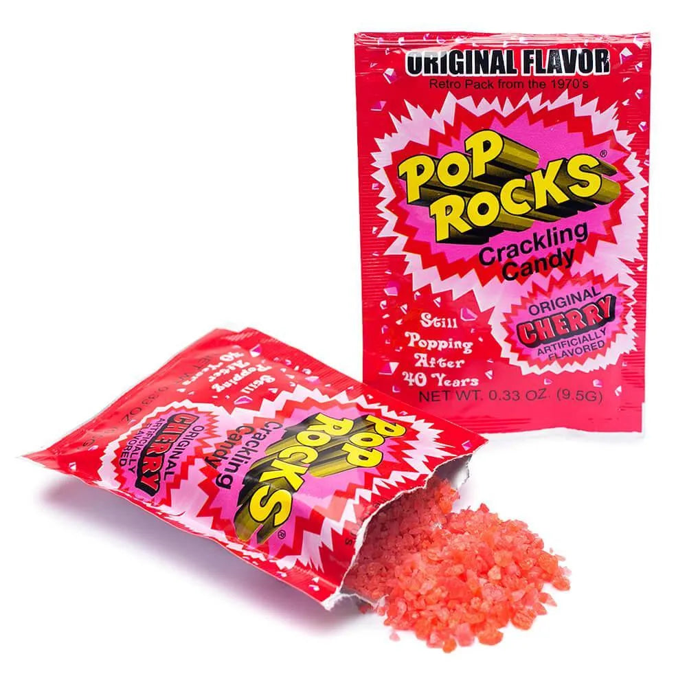Sweet Palace Cherry Pop Rocks popping candy in a clear container, showing vibrant red crystals and fizzy texture.