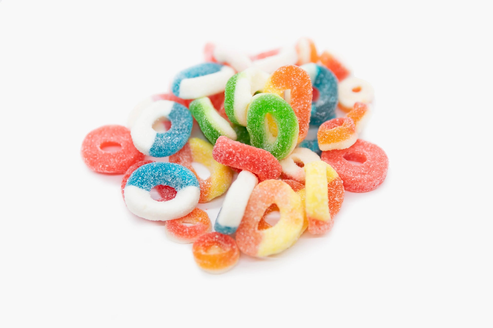 Colorful peach gummy rings from Sweet Palace, shiny and chewy, arranged in a close-up shot showing their vibrant texture.