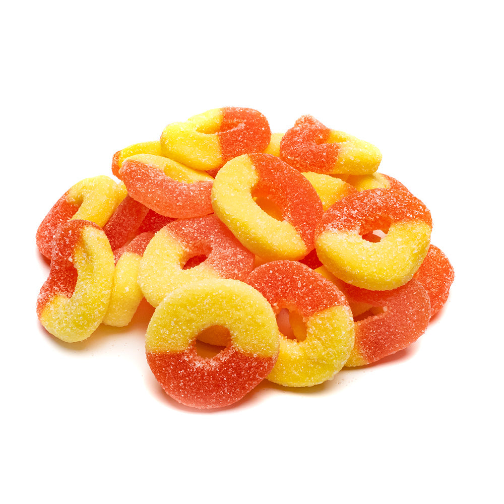 Sweet Palace peach gummy rings, colorful fruit-flavored gummy candies shaped as rings, shown in close-up on a white background.