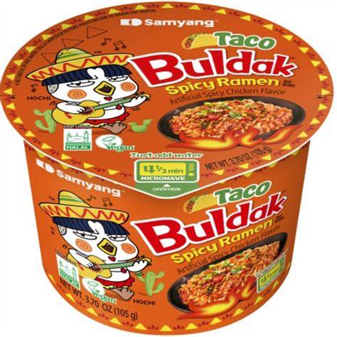 Spicy Buldak Taco ramen in a bowl from Sweet Palace with noodles, sauce, and toppings visible in the image.