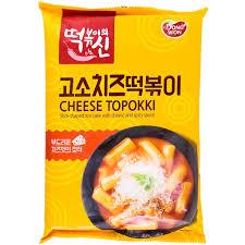 Sweet Palace Dongwon Cheese Topokki Ramen rice cake trays with creamy cheese topping, ready to cook in the image.