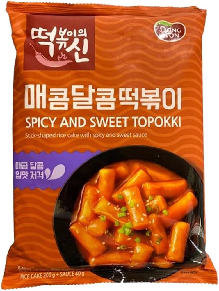 Dongwon Spicy & Sweet Topokki rice cake trays from Sweet Palace, featuring vibrant topokki and sauce in traditional ramen-style trays.