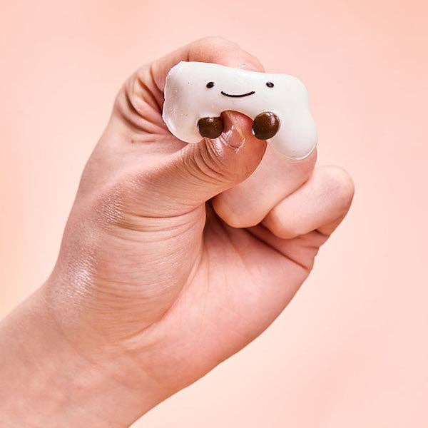 SqueezeSquad Taba Deluxe premium silicone squishy fidget toy in cloud dumpling shape, designed for stress relief and sensory play.