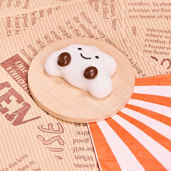 SqueezeSquad Taba Deluxe silicone squishy fidget toy shaped like a cloud dumpling for stress relief and sensory fun.