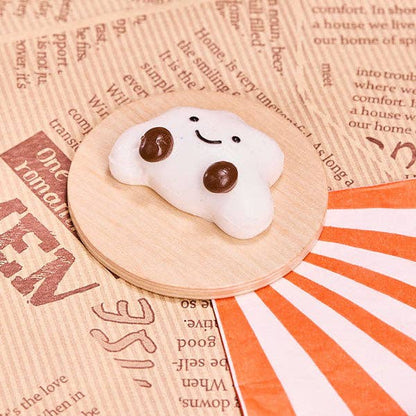 SqueezeSquad Taba Deluxe silicone squishy fidget toy shaped like a cloud dumpling for stress relief and sensory fun.