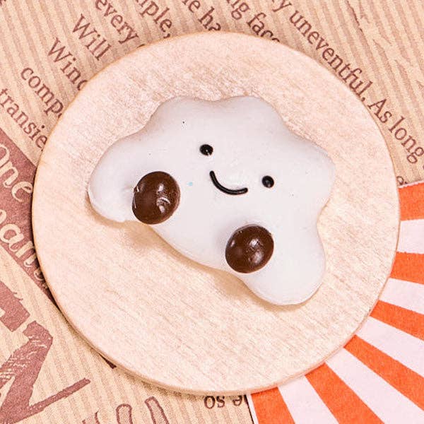 SqueezeSquad Taba Deluxe silicone squishy fidget toy in cloud dumpling shape, soft and squeezable for sensory play.