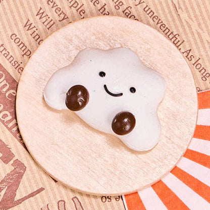SqueezeSquad Taba Deluxe silicone squishy fidget toy in cloud dumpling shape, soft and squeezable for sensory play.