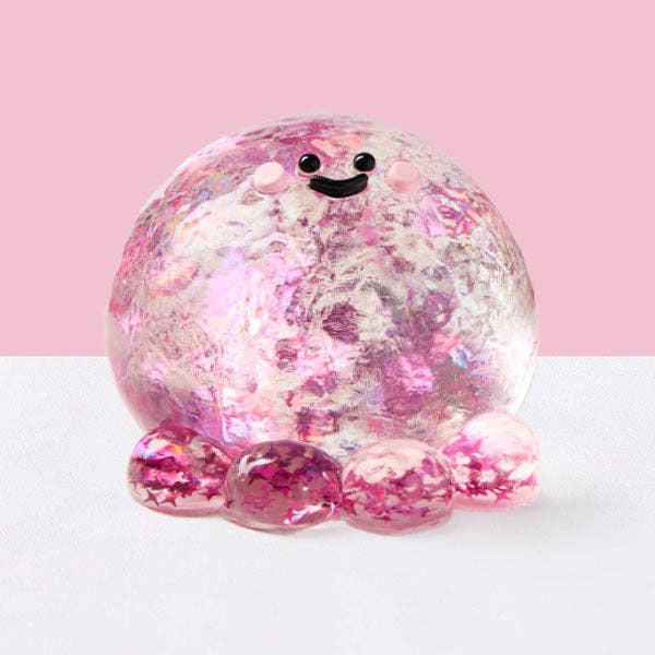 Fuchsia octopus silicone squishy fidget toy from SqueezeSquad Taba Deluxe, soft and squeezable for stress relief and sensory play.