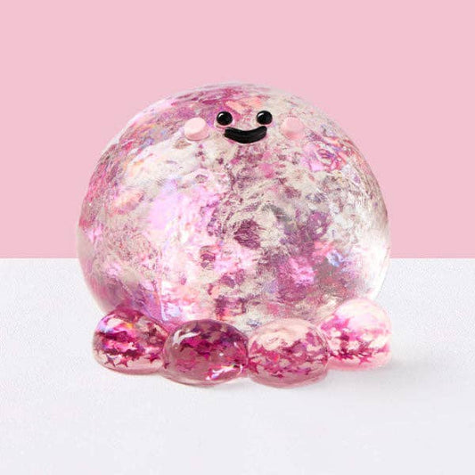 Fuchsia octopus silicone squishy fidget toy from SqueezeSquad Taba Deluxe, soft and squeezable for stress relief and sensory play.