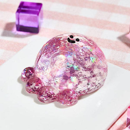 Fuchsia octopus silicone squishy fidget toy from SqueezeSquad Taba Deluxe, designed for stress relief and sensory play.