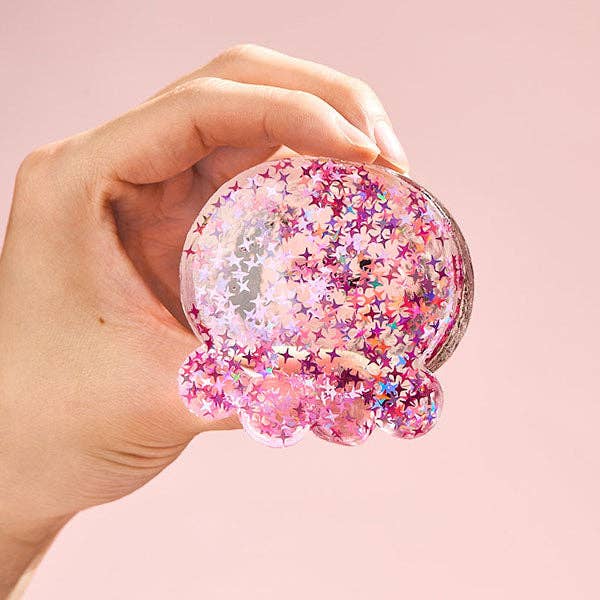 Fuchsia octopus silicone squishy fidget toy from SqueezeSquad Taba Deluxe by The Autism Store, soft and squeezable for stress relief.