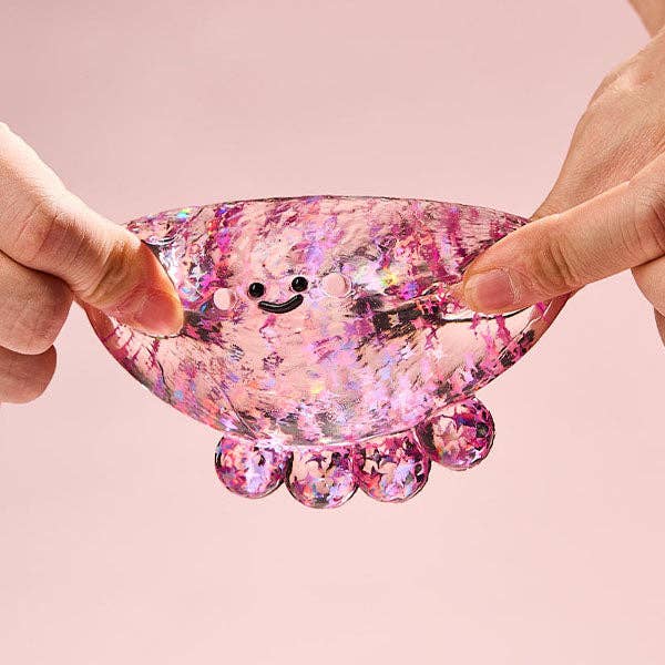Fuchsia octopus silicone squishy fidget toy from SqueezeSquad Taba Deluxe by The Autism Store, soft and squeezable for stress relief.