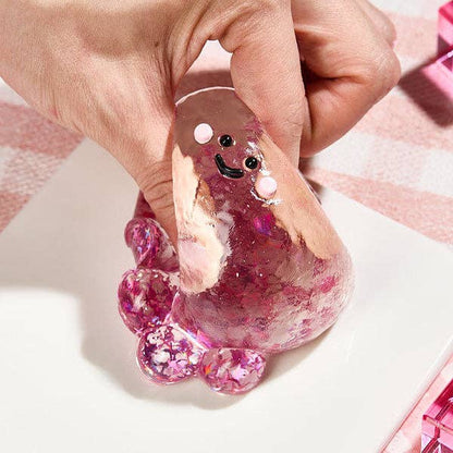 Fuchsia silicone octopus fidget toy from SqueezeSquad Taba Deluxe Premium line, soft and squeezable for stress relief and sensory play.