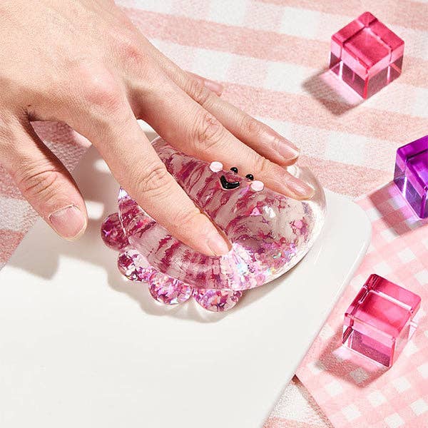 Fuchsia octopus silicone squishy fidget toy from SqueezeSquad Taba Deluxe by The Autism Store, soft and squeezable for stress relief.