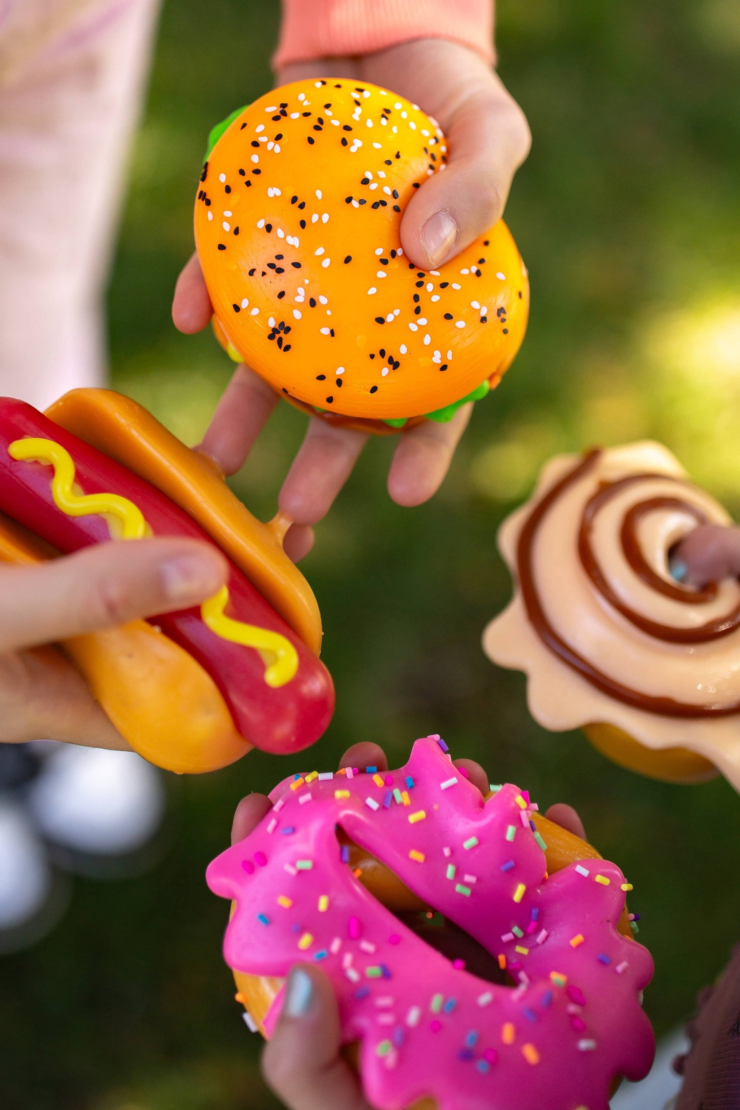 Assorted MushMeez Taba Squishies food collection featuring colorful donut, burger, and snack squishy toys by The Autism Store.