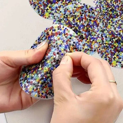 Glow-in-the-dark PocketPick Therapy Tool by The Autism Store, a compact fidget toy for tactile sensory stimulation.