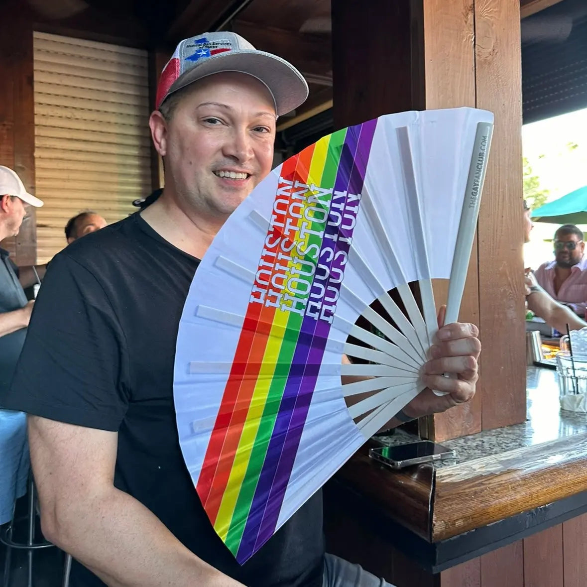 Houston Pride Clack Fan by The Gay Fan Club, handheld fan with colorful Pride design, perfect for celebrations and events.