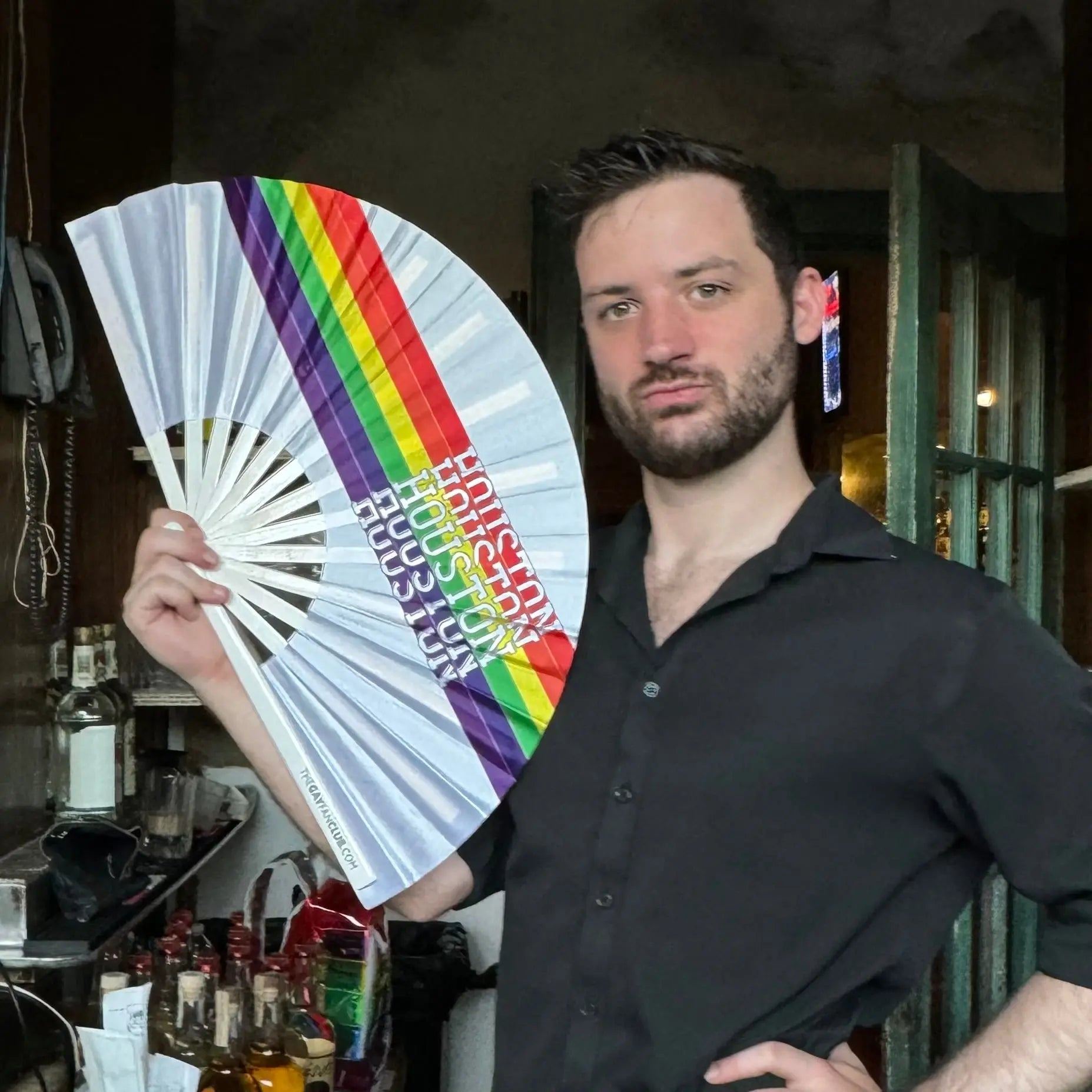 Houston Pride Clack Fan by The Gay Fan Club, hand fan with vibrant pride-themed design and colorful Houston Pride logo.