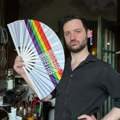Houston Pride Clack Fan by The Gay Fan Club, hand fan with vibrant pride-themed design and colorful Houston Pride logo.