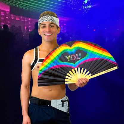 Hand fan by The Gay Fan Club with "Love You" message, featuring colorful design and lightweight fabric for cooling and style.