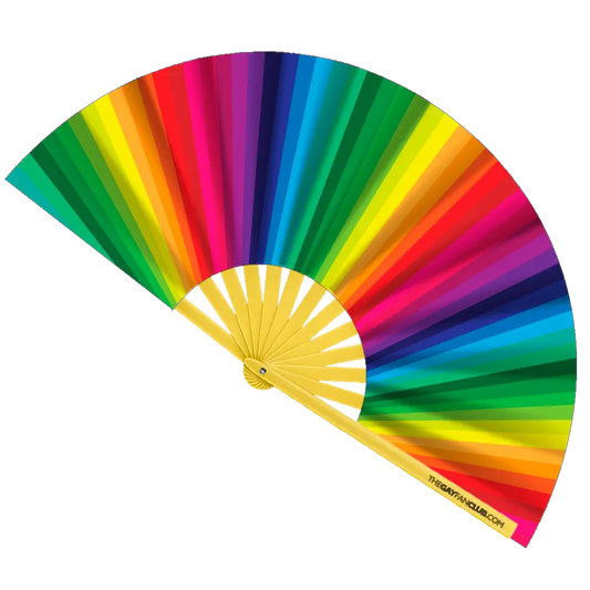 Rainbow folding hand fan by The Gay Fan Club with vibrant rainbow colors and foldable design.