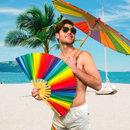 Rainbow folding hand fan by The Gay Fan Club with vibrant rainbow colors and a compact, foldable design.