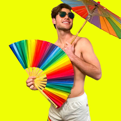Rainbow folding hand fan by The Gay Fan Club featuring vibrant rainbow colors and a compact, foldable design.