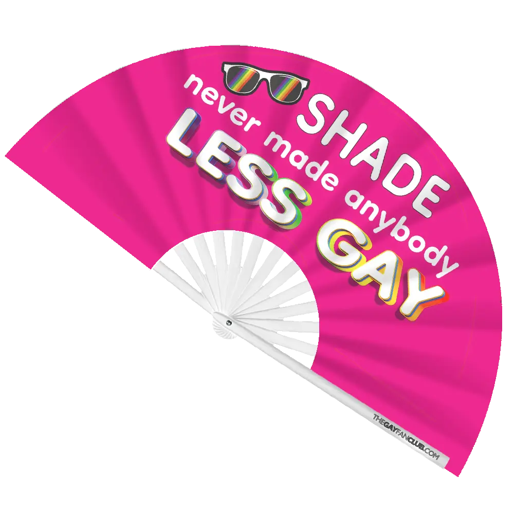 Hand fan from The Gay Fan Club featuring the shade never made anybody less gay slogan on a fabric surface.
