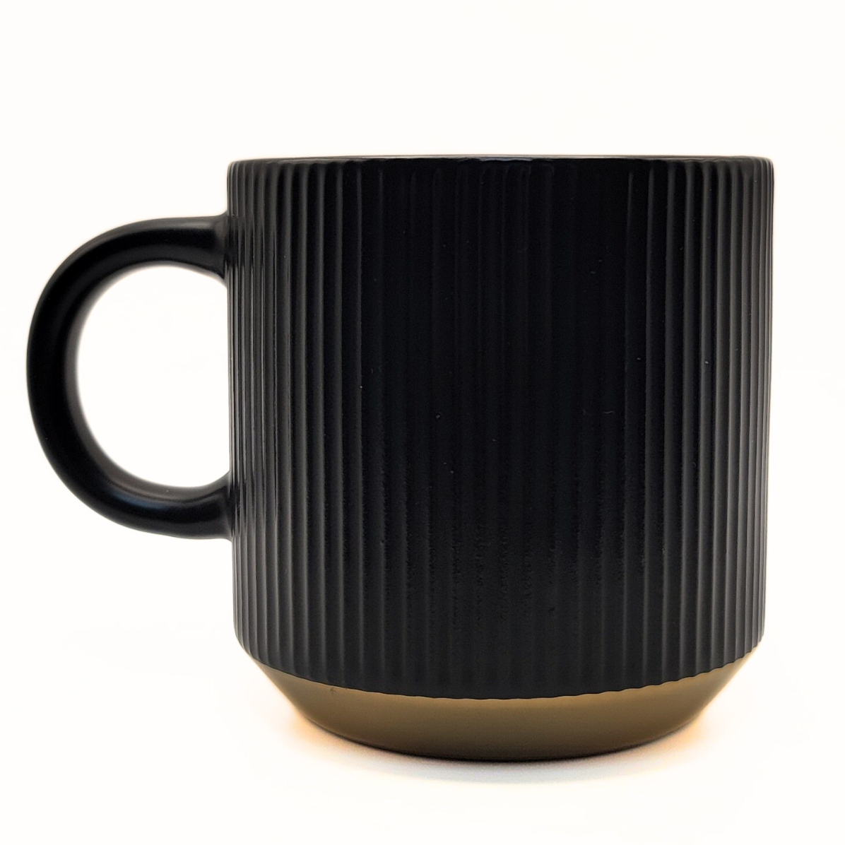 Black ceramic mug from Pali Coffee Co by The Palestinian Coffee Company featuring Palestinian-themed design.