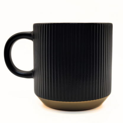 Black ceramic mug from Pali Coffee Co by The Palestinian Coffee Company featuring Palestinian-themed design.