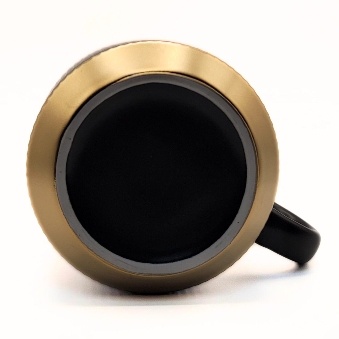 Black ceramic mug from The Palestinian Coffee Company featuring Pali Coffee Co branding, perfect for coffee lovers.