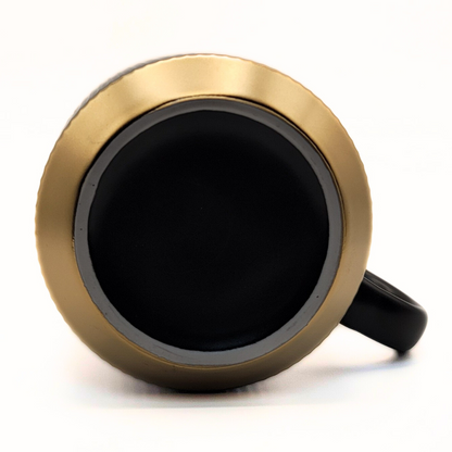 Black ceramic mug from The Palestinian Coffee Company featuring Pali Coffee Co branding, perfect for coffee lovers.