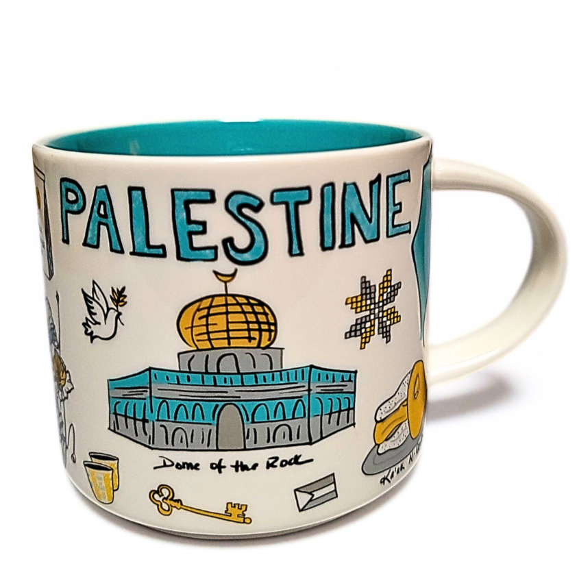Palestine Mug by The Palestinian Coffee Company featuring traditional Palestinian design and bold lettering on ceramic.