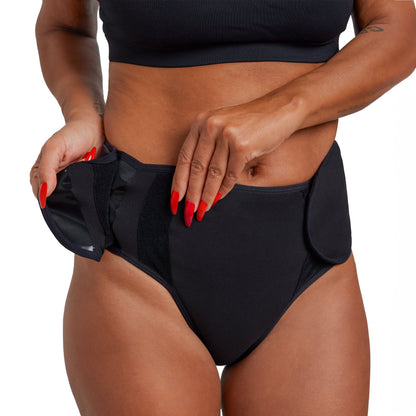 Black XS The Adaptive Period microfiber pad by The Period Company for heavy menstrual flows, showing its absorbent, ergonomic design.