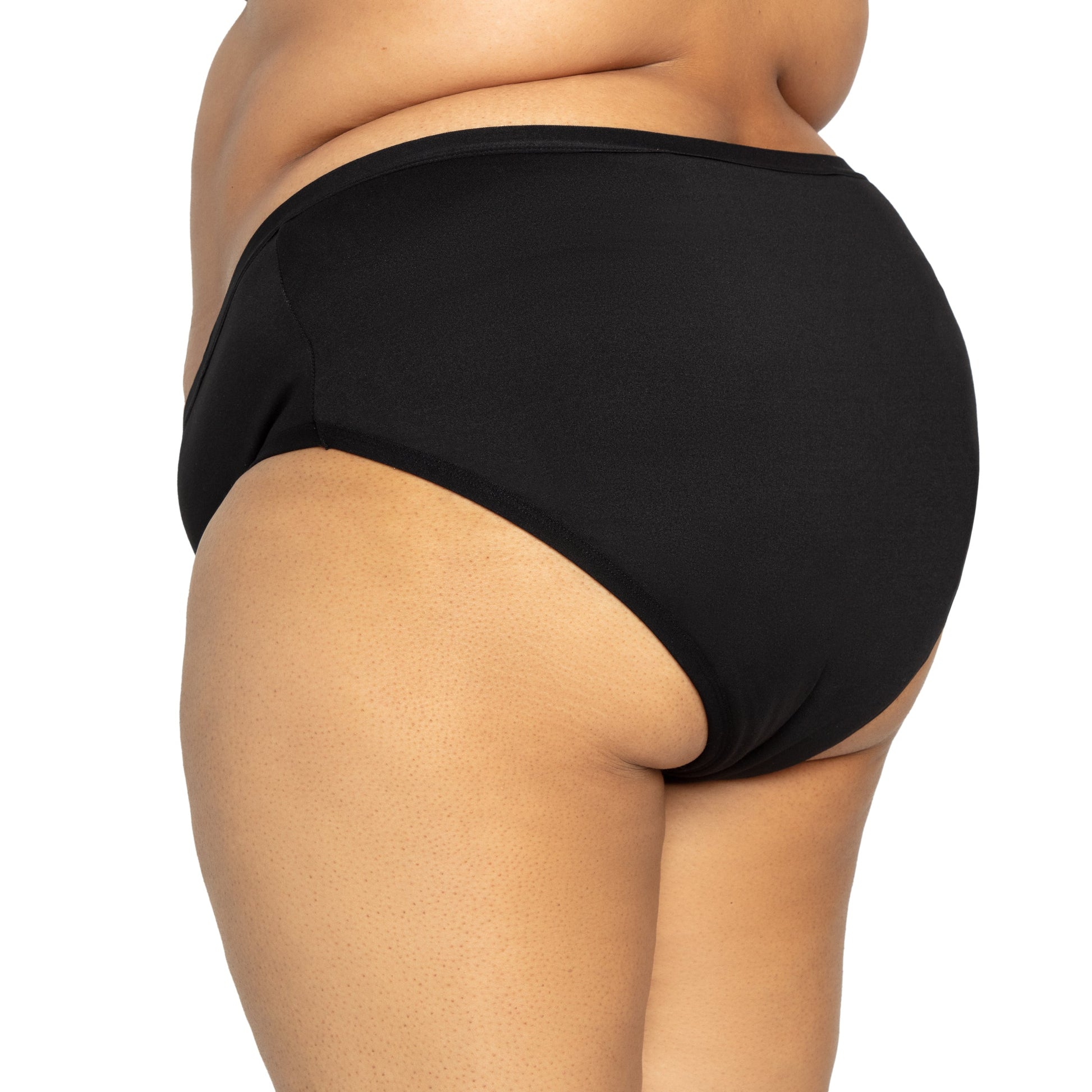 Black microfiber The Bikini Period menstrual pad by The Period Company for medium flows, shown folded with soft fabric texture.