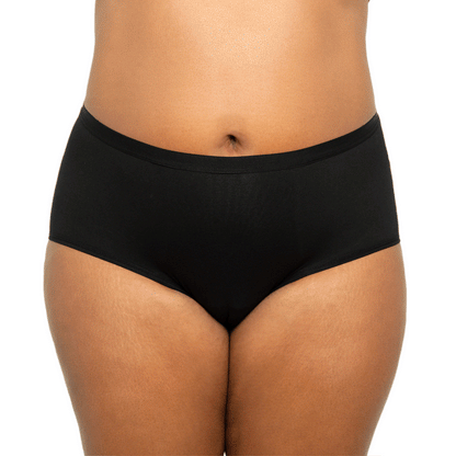 Black high-waisted cotton period underwear for medium flows by The Period Company, shown on a model.
