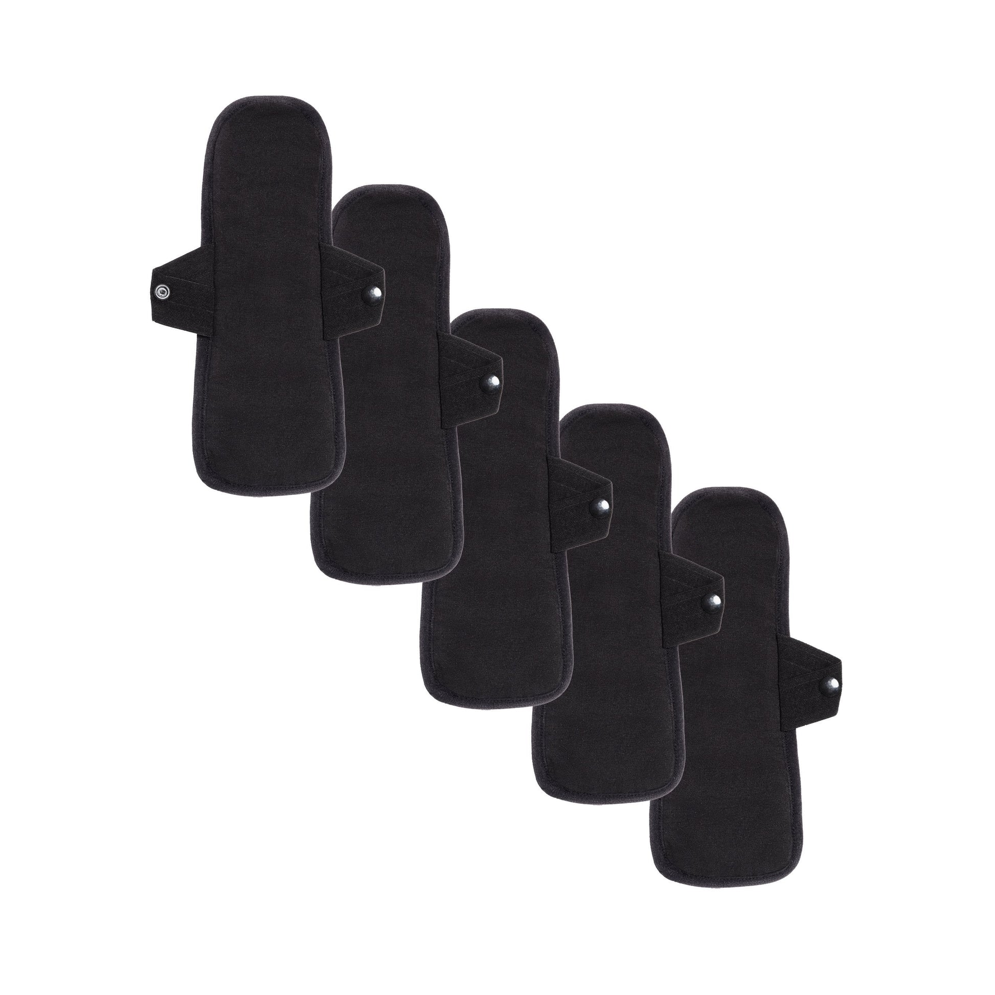 Set of five reusable pantyliners for medium flows by The Period Company, showing black, soft, eco-friendly feminine pads.