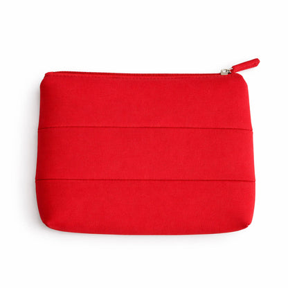 Red The Period Company pouch with logo, compact and stylish storage bag for menstrual products.