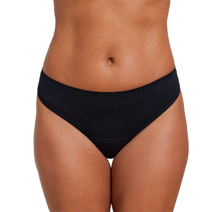 Light flow thong pad from The Period Company in SportyStretch™ fabric, shown in a close-up of the discreet, comfortable design.