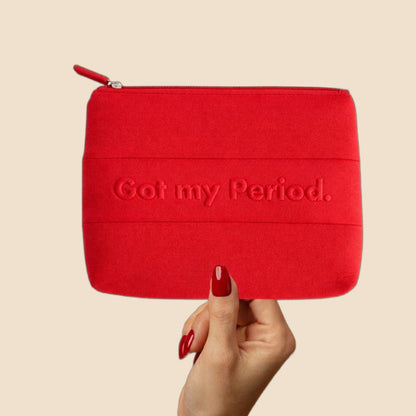 The Period. Pouch by The Period Company, a stylish pink and white feminine care pouch with the brand logo on the front.