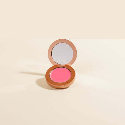 YENSA Super Serum Silk Buildable Cream Blush in Moody Mauve, showcasing a creamy, blendable blush applicator on smooth skin.