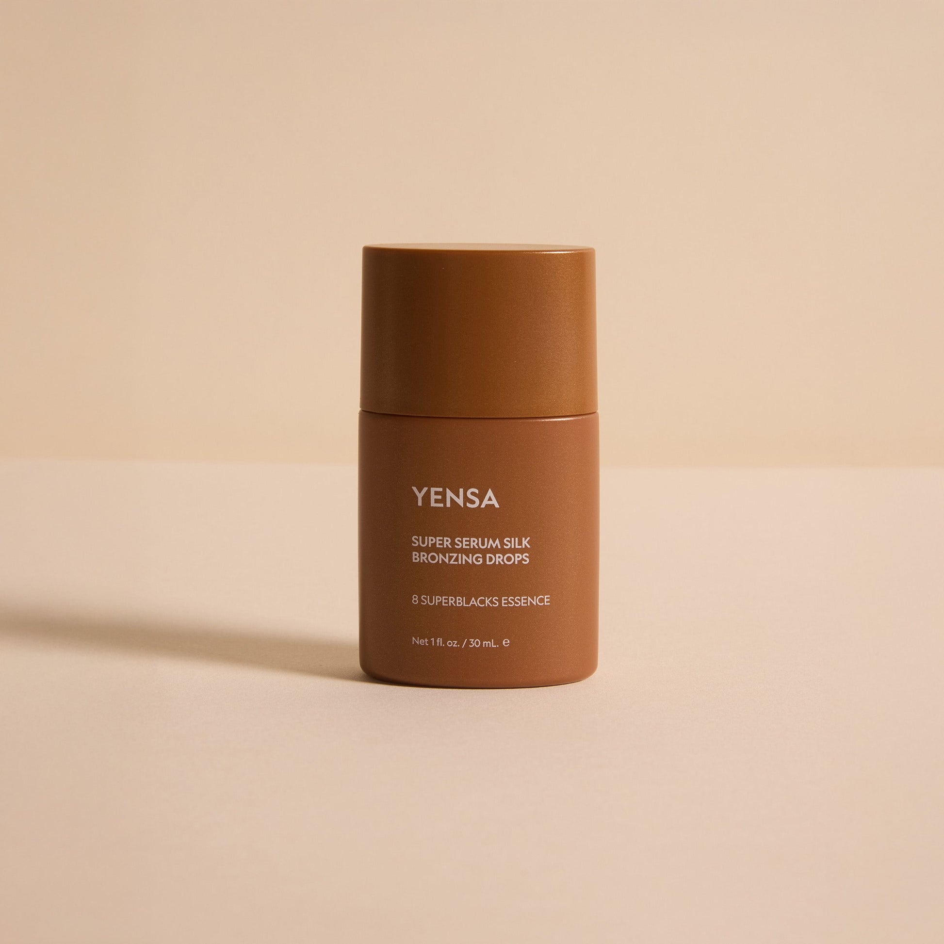 YENSA Super Serum Silk Bronzing Drops in a dropper bottle, highlighting their silky bronze liquid formula for a natural glow.