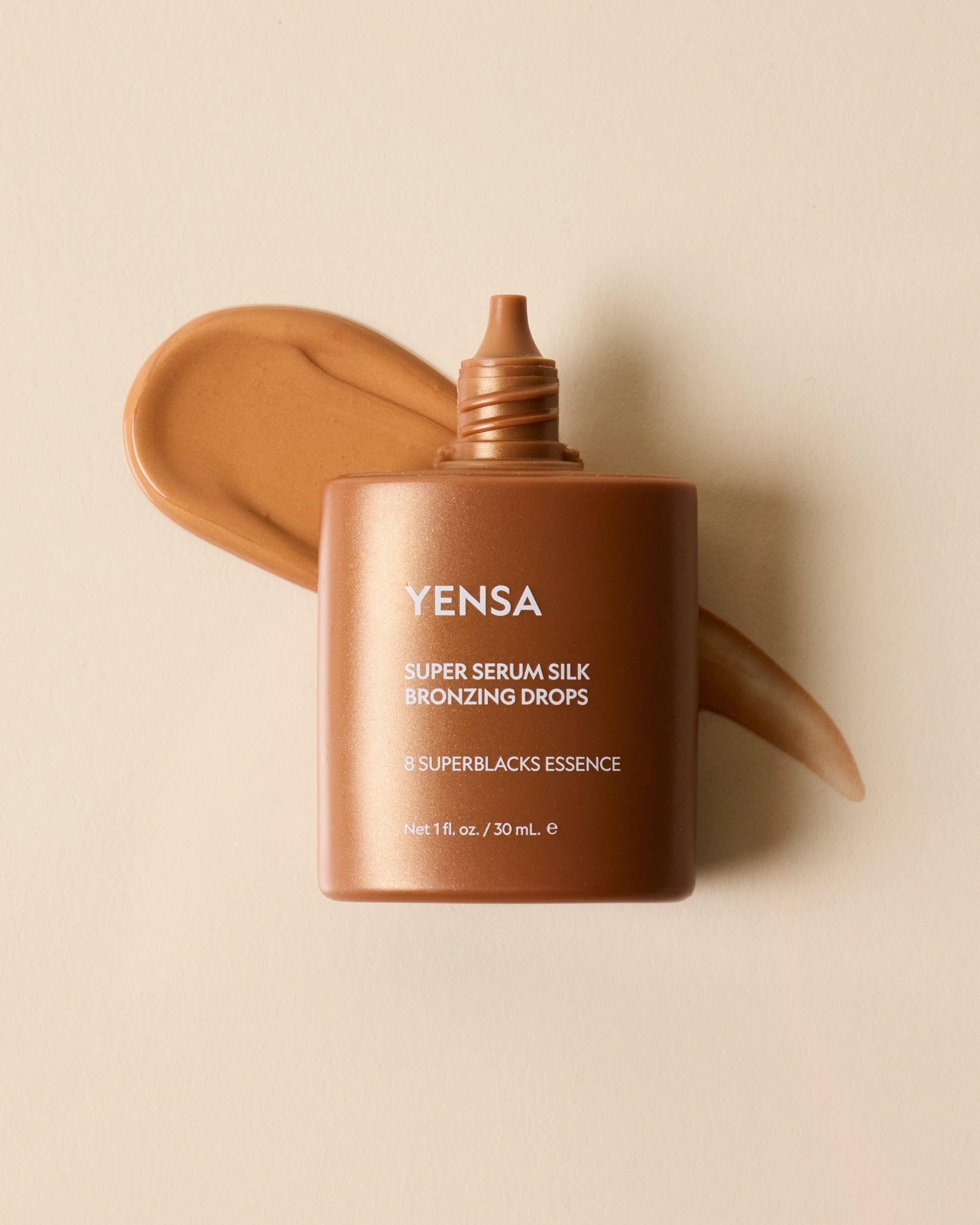 YENSA Super Serum Silk Bronzing Drops in a dropper bottle, showcasing the bronzer product with a sleek design.
