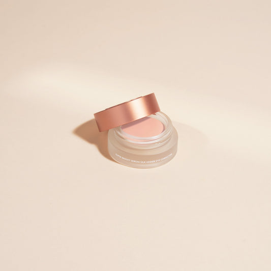 YENSA Super Bright Dark Circle Serum Eye Corrector in fair shade, featuring a sleek tube with the product’s label and applicator.