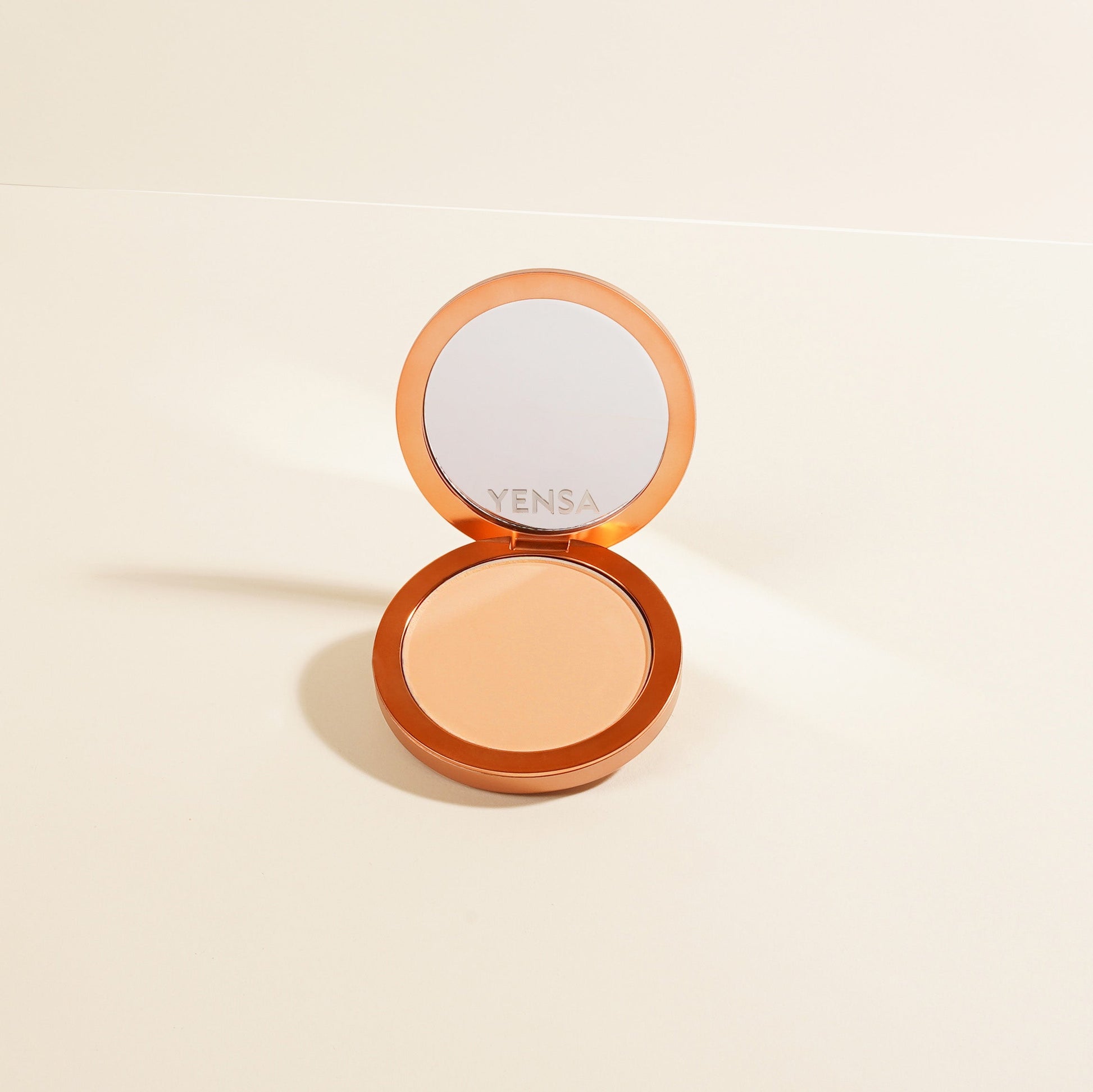 YENSA Super Serum Silk Matte Powder Foundation in fair shade, showing smooth, pressed powder with a matte finish and peptide formula.